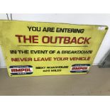 A cast-iron sign: 'You Are Entering The Outback'