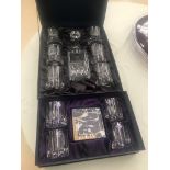 A boxed crystal glass set;