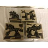 Four bronzed horse racing figures