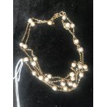 A 14ct and pearl necklace