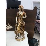 A large gilt figure of a lady