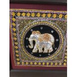 A large framed Indian tapestry with elephant decoration