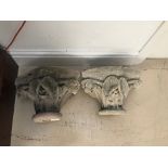 A pair of stone capitals/corbals