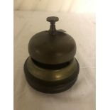 A brass reception bell