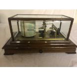 An oak-cased Negretti & Zambia Ltd barograph