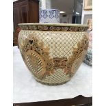 A large ceramic gilt fish bowl