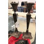 A pair of HM silver candlesticks