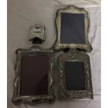 Four HM silver photograph frames