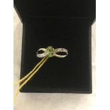 A 9ct gold peridot and diamond ring