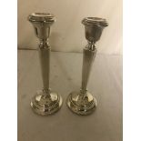 A pair of HM silver candlesticks