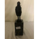 A signed bronze of a boy on marble base