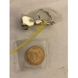 A silver metal Masonic key ring;