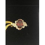 A 9ct gold natural garnet and diamond ring