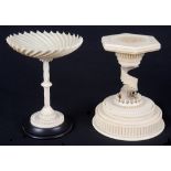 Two 19th Century Ivory Stands: Ebony based stand with concentric carved cup on twisted stem.