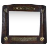 An Arts & Crafts Mirror: Inset with decorative copper relief designs,