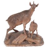 A 19th Century Black Forest Carved Ibex & Young: The mother standing over her young on a rocky