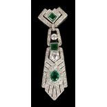 An Art Deco Diamond and Emerald Pendant: Period 9ct articulated diamond and emerald pendant on 9ct