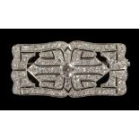 An Art Deco Brooch/Pendant: Unhallmarked 18ct gold,