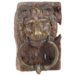 A Bronze Lion's Head Door Knocker: 18th/19th Century, mounted on wooden base.