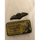 An Australian Flying Corps pilot officer's wings in German tobacco tin (A/F)