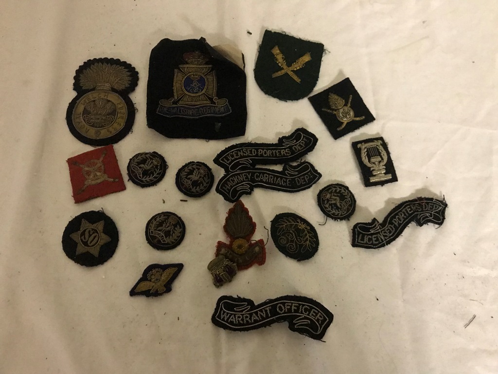 19 wired & bullion military badges to inc Welsh Fusiliers Wiltshire Regiment etc