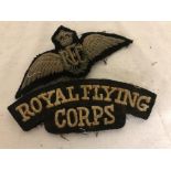 A pilot officer's wings and shoulder titles