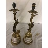 A pair of Empire-style cherub lamp bases