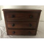 An Edwardian mahogany apprentice chest of drawers