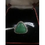 A 14K jade and diamond dress ring