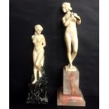 Two Art Deco ivory figures of nude female subjects: one modelled leaning against its original