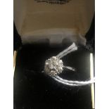 An 18ct diamond daisy ring