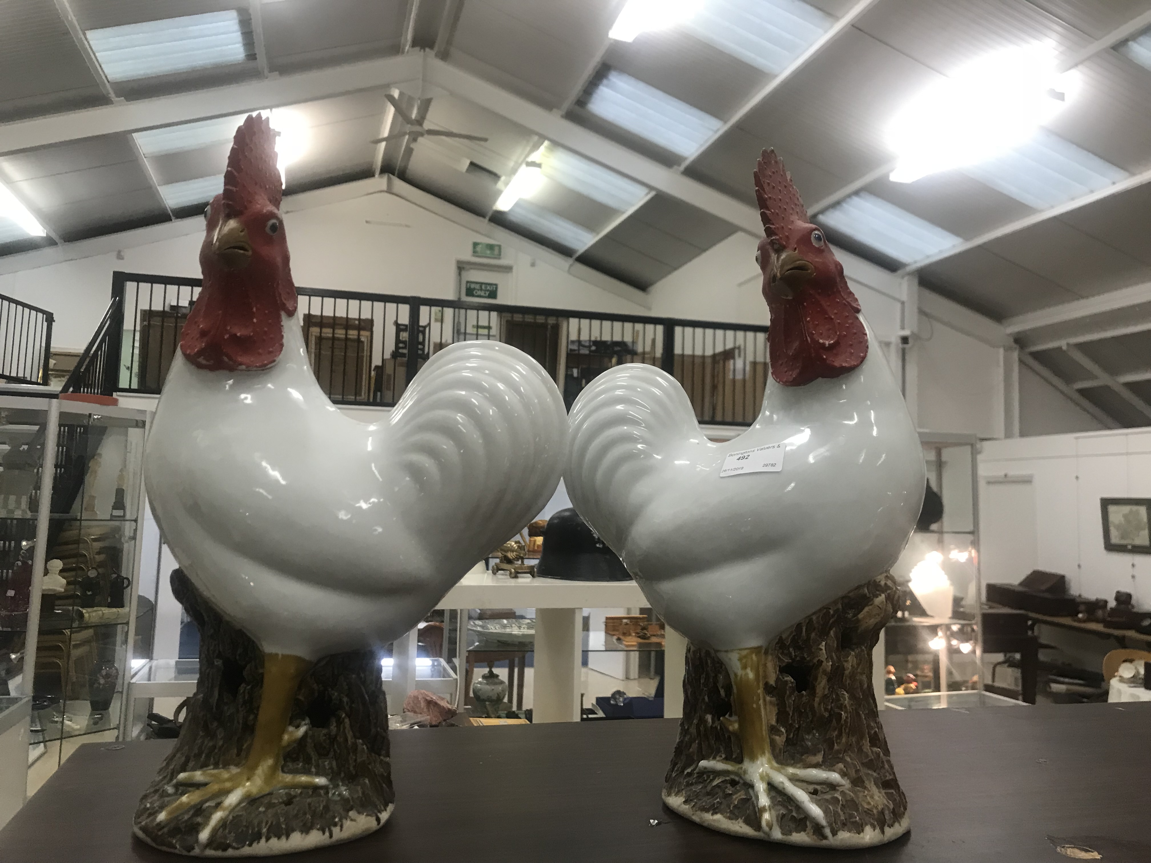 A pair of Chinese Qing Dynasty roosters, on stump bases with glazed white bodies, painted combs, - Image 2 of 2