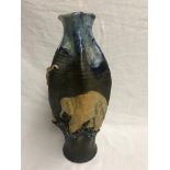 A Sumida Gawa Meiji period vase with blue flambe and brown decoration and with elephant relief,