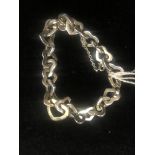 A Tiffany silver and 18ct gold heart bracelet (American bought)