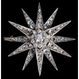 A Portuguese Boxed Diamond Star Brooch: A 12-sided star set with diamonds of mixed cuts,