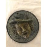 An early 19th century Fulham pottery stoneware vesta wall plaque depicting an old mans head in