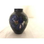 A miniature Moorcroft vase,