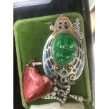 Three Art Nouveau brooches to include enamelled heart on copper,