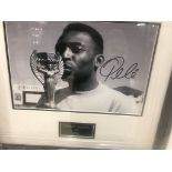 A framed and glazed signed photograph of Pele