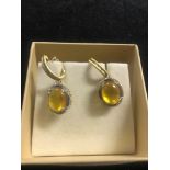 A pair of 14K diamond and citrine earrings