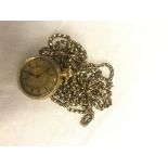 An 18ct ladies pocket watch on a very long 9ct longguard chain