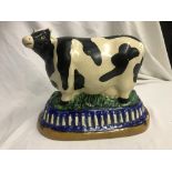 A Majolica glazed ceramic cow