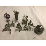 A quantity of silver miniatures to include dolphins, bikes etc.