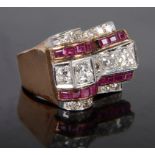 An Art Deco Diamond and Ruby Ring: Of stepped design in white and gold settings,