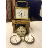 A cased miniature carriage clock together with three travelling clocks