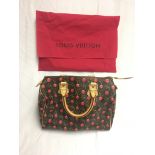 A Louis Vuitton cherry monogram handbag;