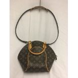 A Louis Vuitton monogram handbag and strap;