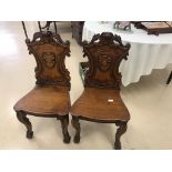 A pair of mahogany Victorian hall chairs