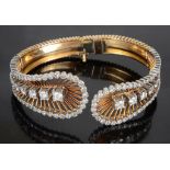 A Diamond Set Filigree Bangle: In unhallmarked 18ct gold,