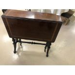 An Edwardian mahogany inlaid Sutherland table